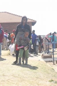 Woman and child with relief goods