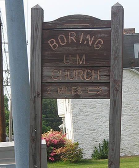 A wooden sign that reads Boring U.M. Church