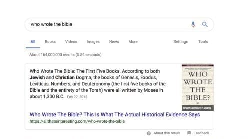 The top half of a search engine results page with the phrase ‘who wrote the bible’ typed into the search bar.