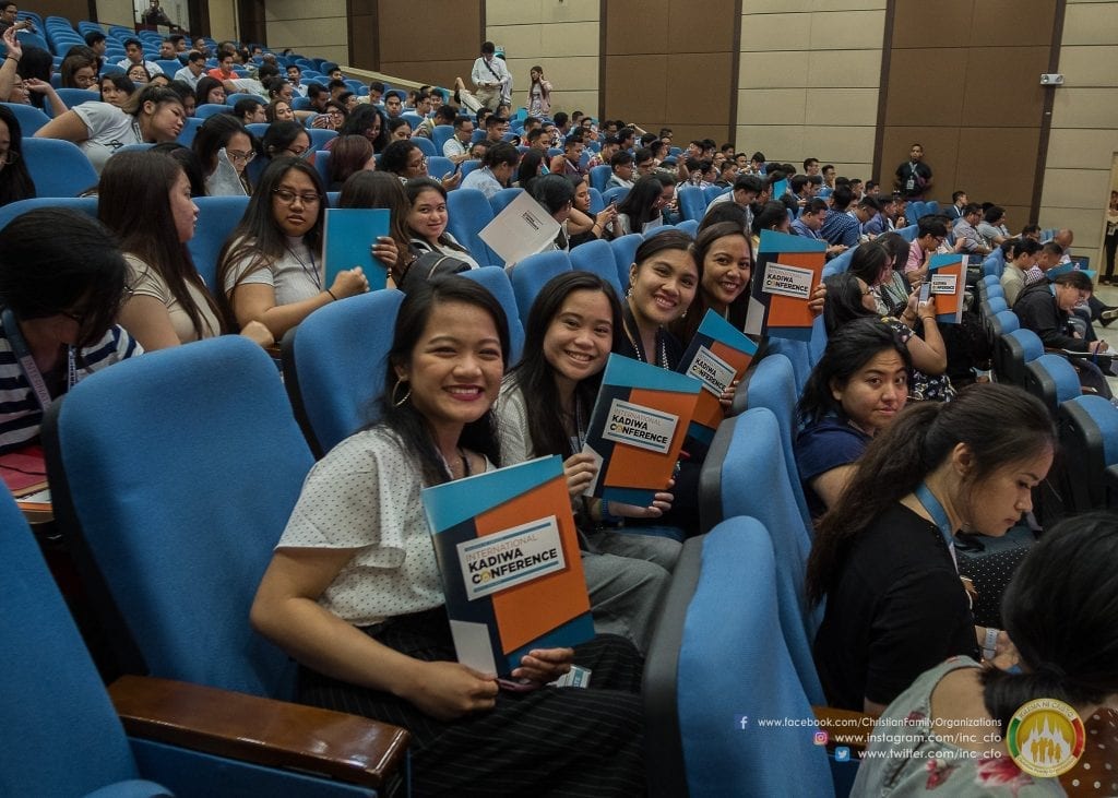 group of girls with conference folders
