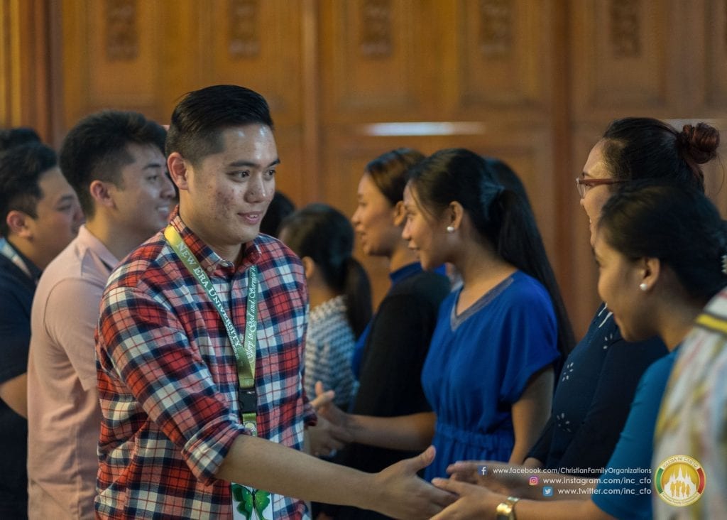 Emmanuel Ornedo shaking hands