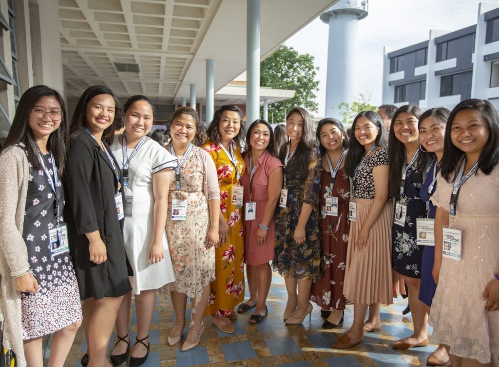 Group of girls wearing formal clothing and smiling
