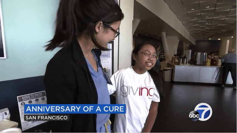 ABC7 log in the corner; nurse and young girl embracing and smiling. 