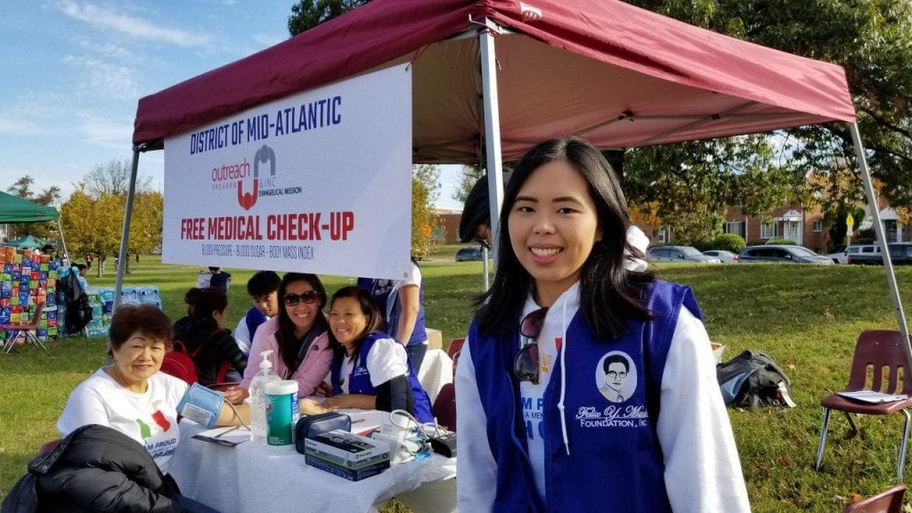 Krisan Esselle Fragata volunteering at Felix Y. Manalo “Aid to Humanity”event