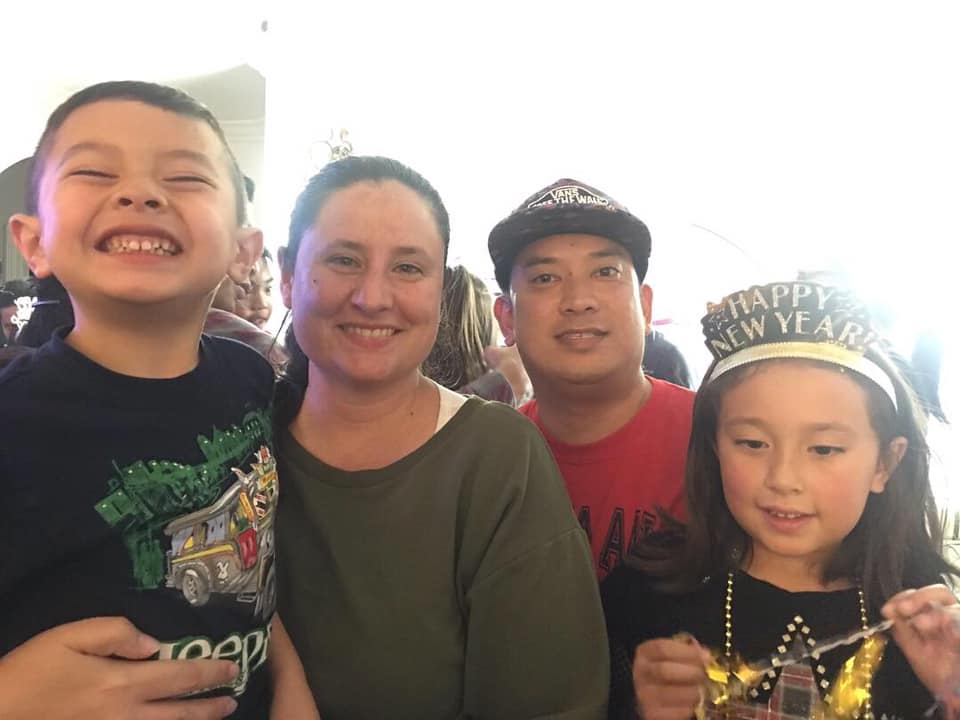 Family of Four taking a photo