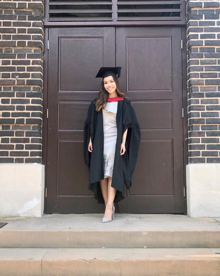 Female graduate with gown and cap