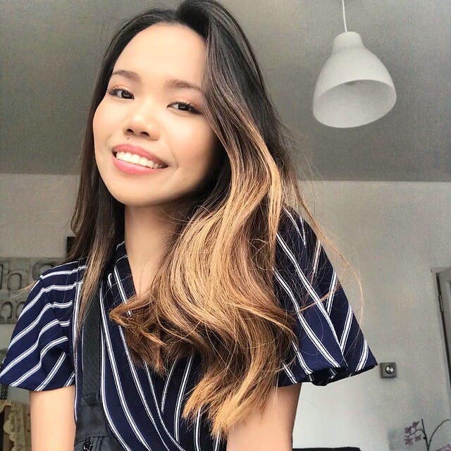 Woman smiling at camera indoors