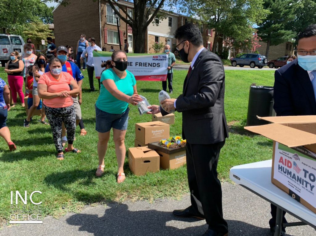 Minister from Iglesia Ni Cristo (INC) or Church Of Christ handing out donations during a community outreach event, held in August 2020.