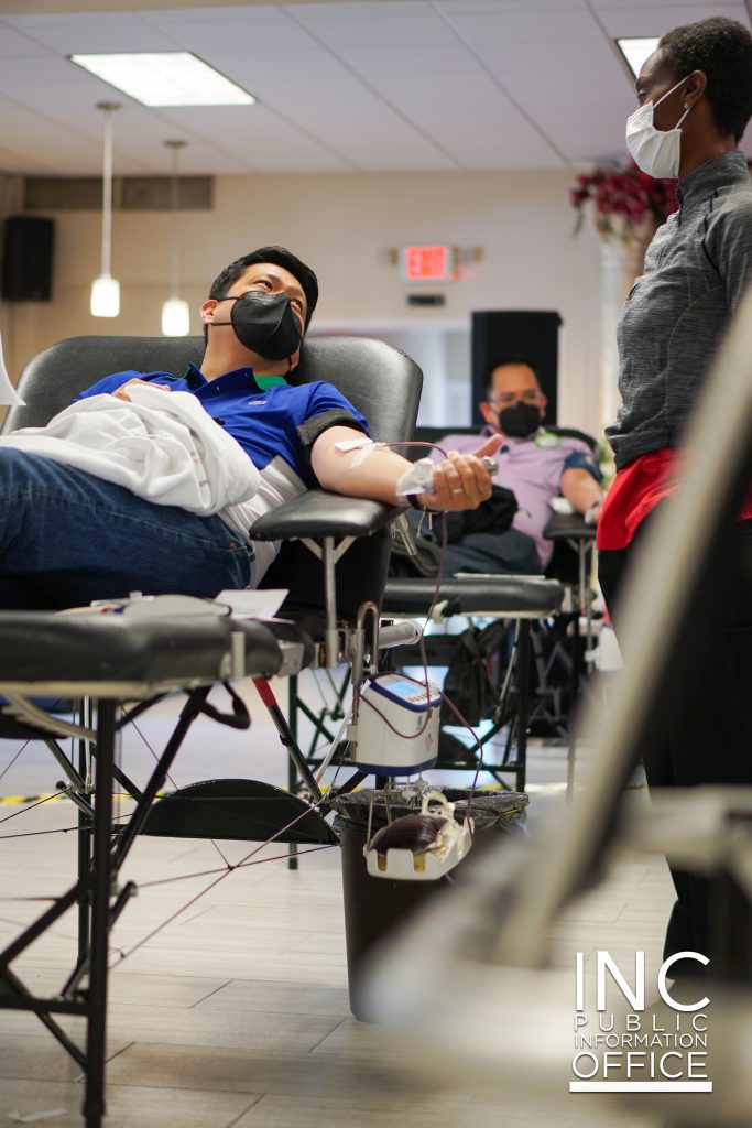 Minister from Iglesia Ni Cristo (INC) or Church Of Christ, talking to an American Red Cross technician during a Blood Donation Drive, held in May 2021.