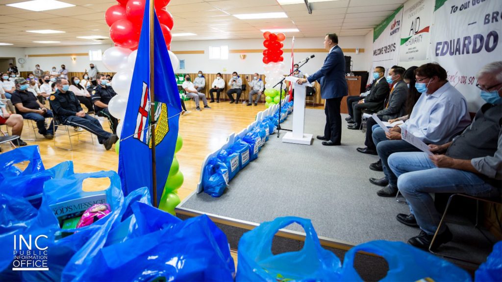 INC Minister of the Gospel Voltaire Tamisin speaks to donation recipients and residents of Manning, Alberta at Royal Canadian Region building during the Aid To Humanity event sponsored by the Iglesia Ni Cristo