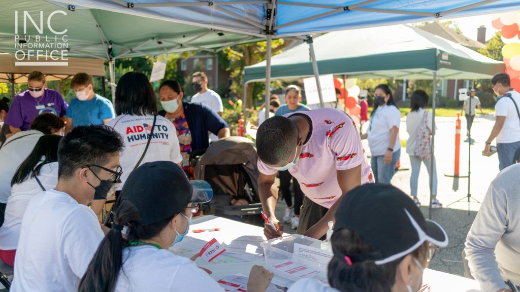 Aid To Humanity attendees going through a temperature and health check prior to entering