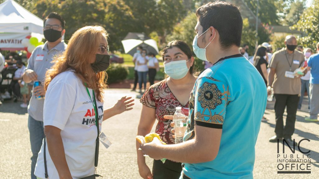 A member of the Iglesia Ni Cristo (Church Of Christ) entertains guests at the Aid To Humanity event.