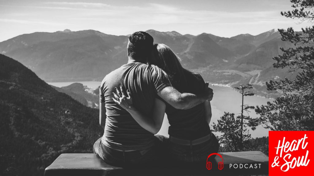 Couple embracing on a hill