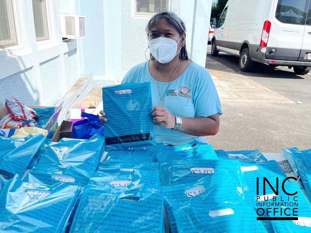 INC volunteer with ‘Thank You’ bag