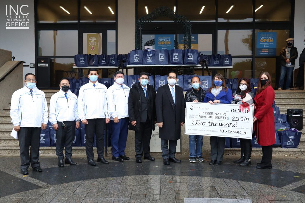 INC ministers pose for a group photo with the recipients from the Red Deer Native Friendship Society in front of the Red Deer City Hall.