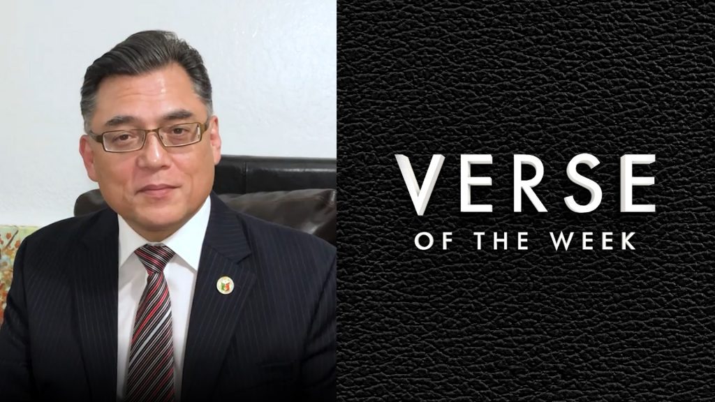 man with glasses. black background with the words verse of the week.