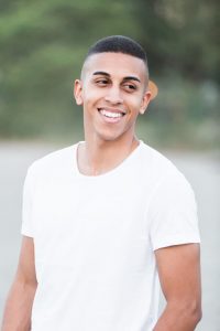 YOUNG MAN IN WHITE SHIRT
