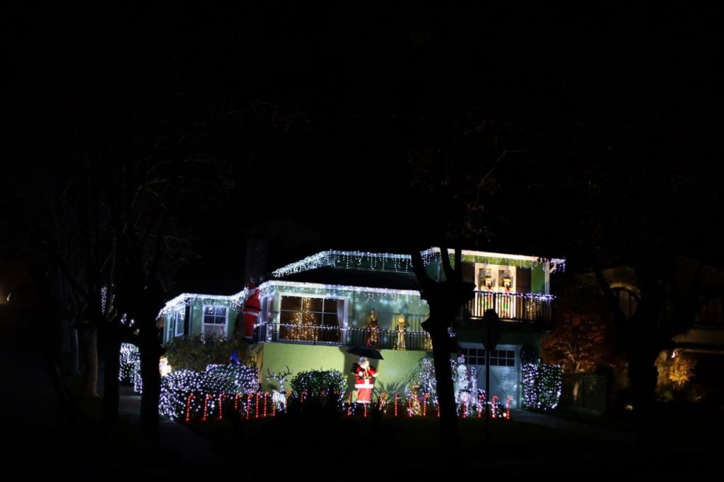 A home decorated for Christmas at night.