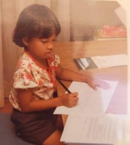 YOUNG GIRL AT A DESK
