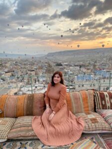 girl city on a couch with the city as her background