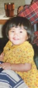 young child wearing yellow