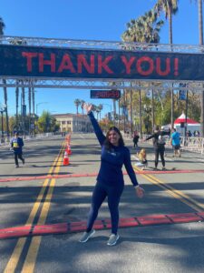 runner in front of a thank you sign