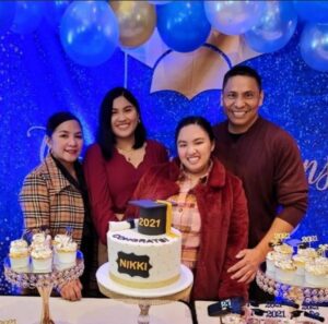 family of four with cake